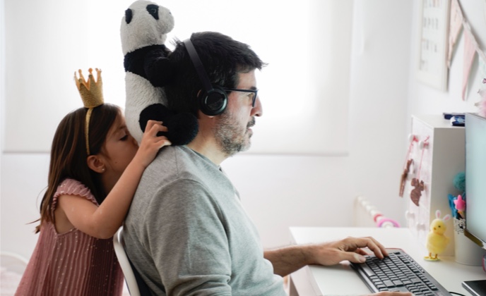Man with daughter using computer